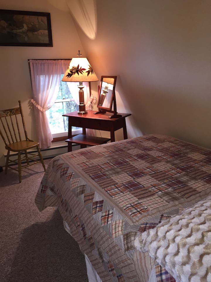 One of two upstairs bedroom with full size bed.