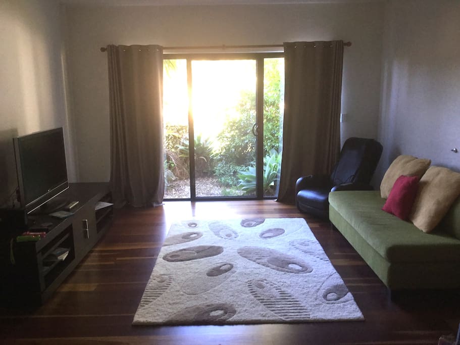 Guest lounge with TV, Wii, double sofa be, microwave, kettle and massage chair
