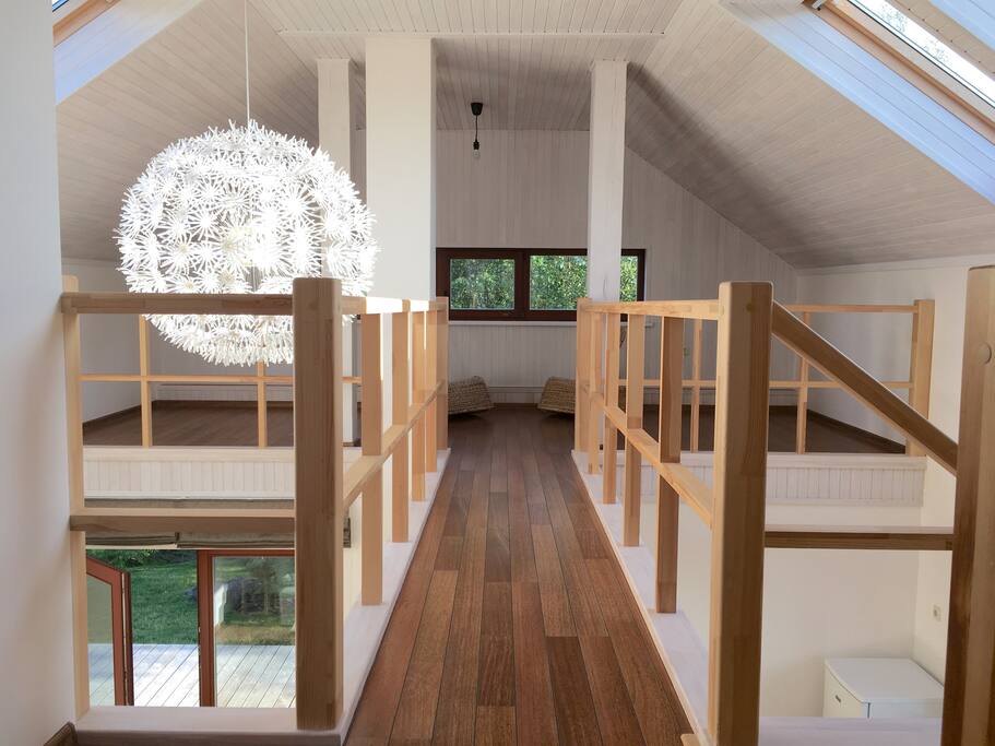 Loft space connected by a bridge.
