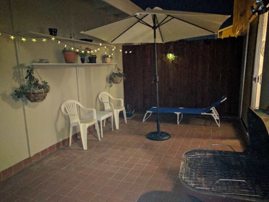 patio with BBQ and solar light.
