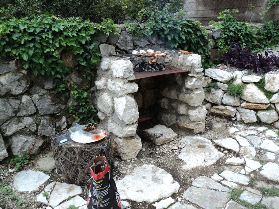 BBQ area behind pool.
