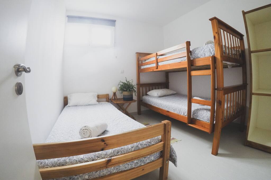 Bedroom with bunkbed and one single bed