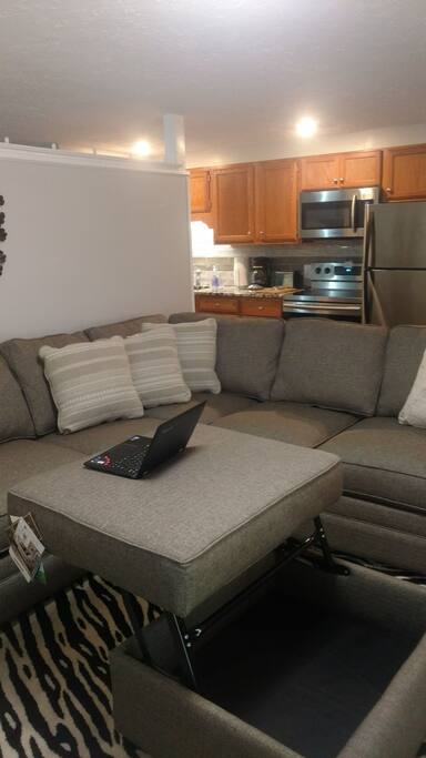 New ottoman that raises up that can be used as a desk for laptop used as a work top desk.
