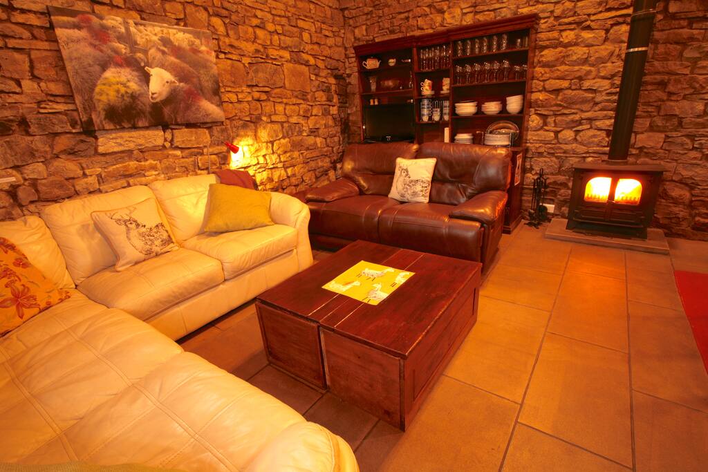 A wood burning stove & underfloor heating.