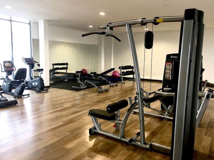 Gym on the top floor, next to the pool and multipurpose hall