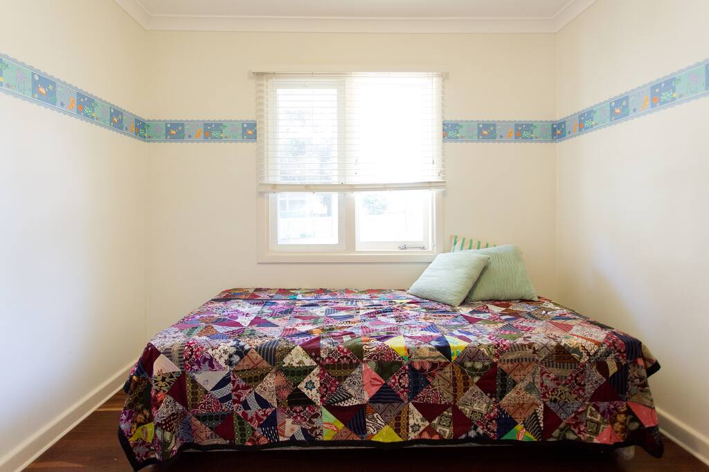 Guest room. The window has a view into the back garden.