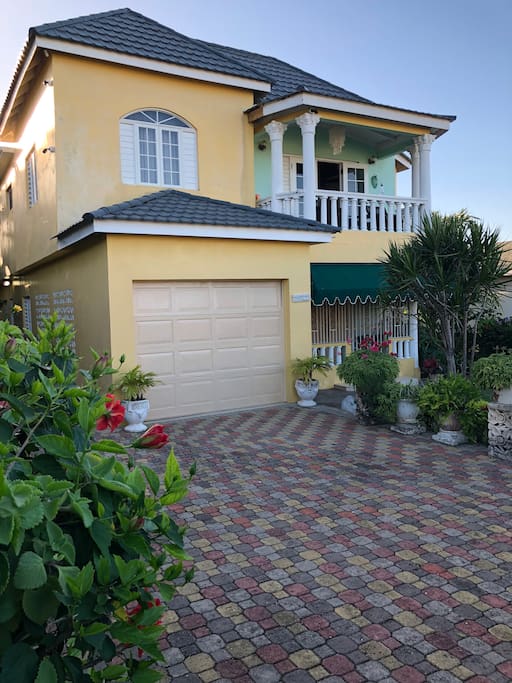 Front view, showing driveway and Patio