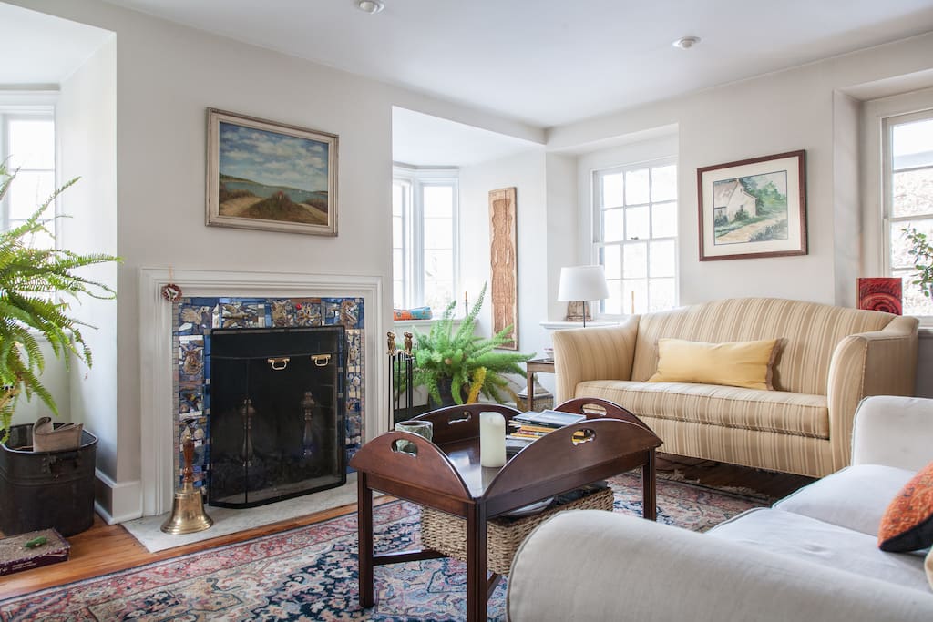 Living room shows an early mosaic my Philadelphia artist Isaiah Zagar of The Magic Gardens.