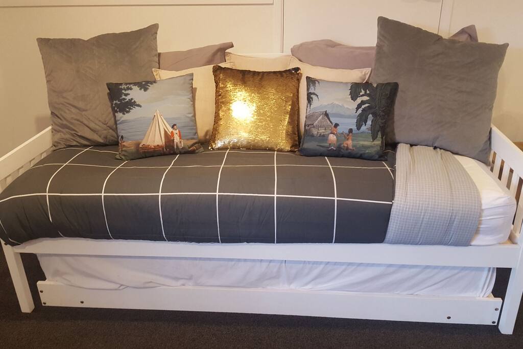 Day bed with a pull out trundler underneath.