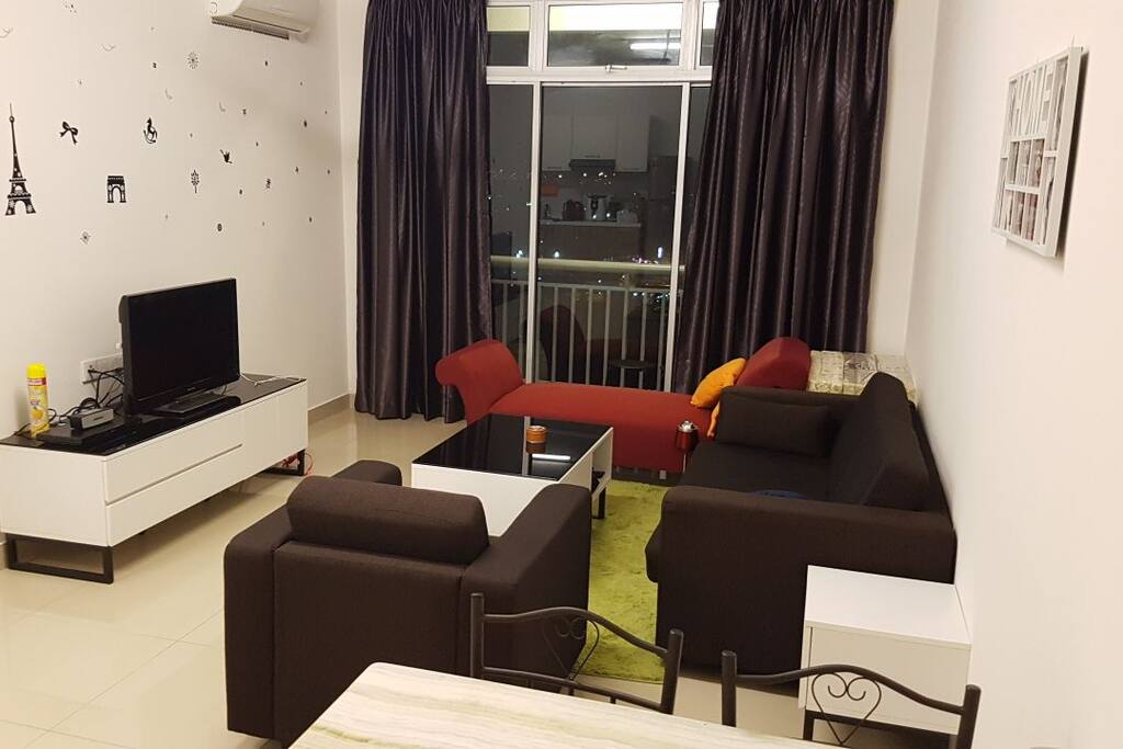 Living hall with lazy couch and TV