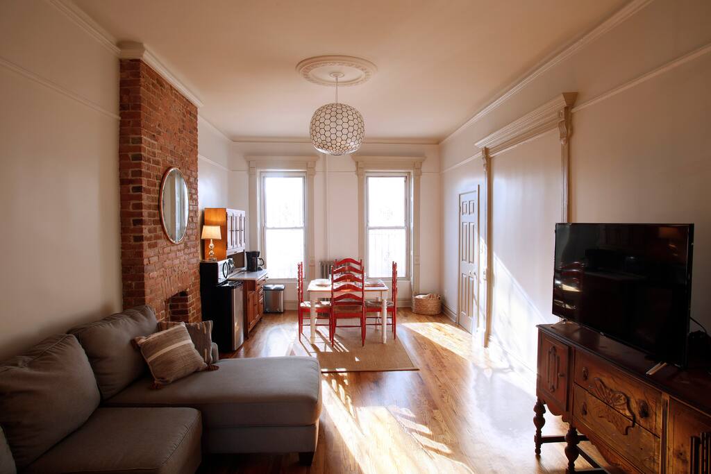 Sun-drenched, spacious living/dining space with kitchenette.