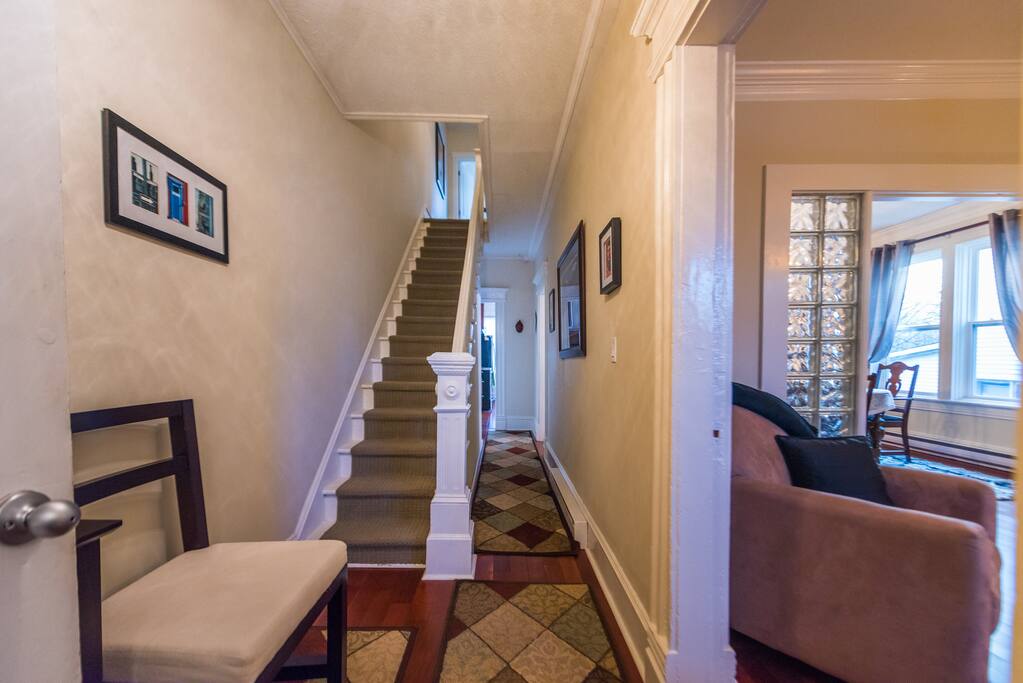 This is what you see just inside the porch. The main level features a large living room & dining room, plus kitchen at the back, while the 2 bedrooms & bathroom are upstairs.