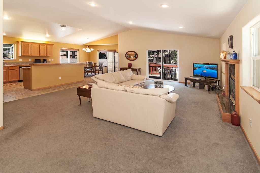 Open floor plan with a large living room, kitchen, and dining area