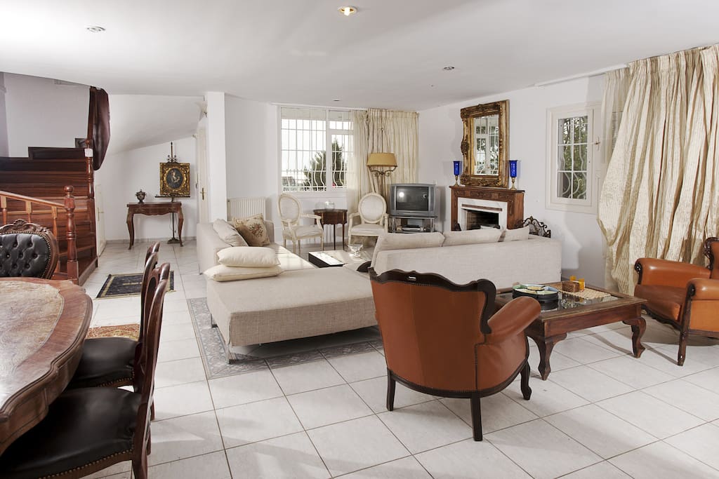 A spacious living room with direct access to the garden