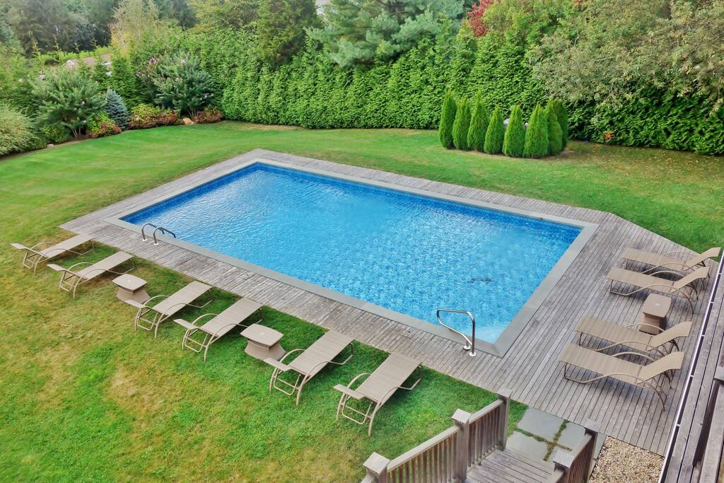 Pool area with 10 lounge chairs
