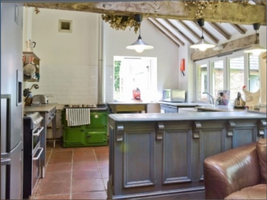Massive kitchen/breakfast room with Rayburn, double electric ovens, dishwasher, fridge and fridge freezer
