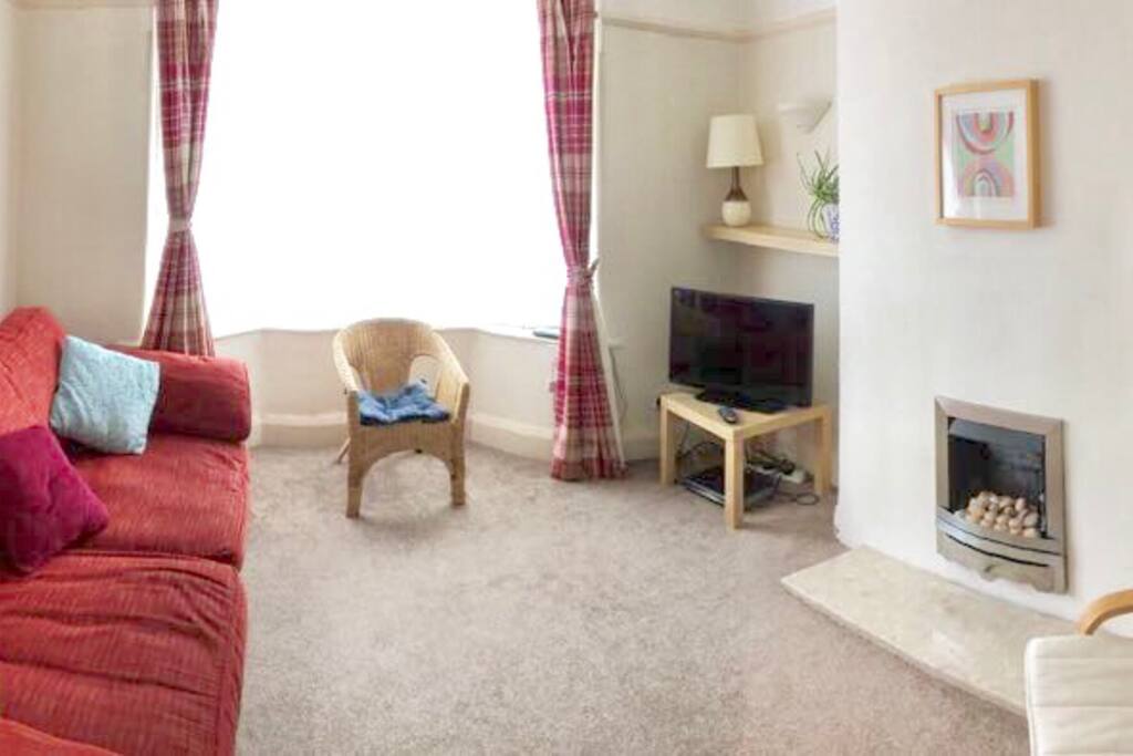 Light sunny living room overlooking free parking outside