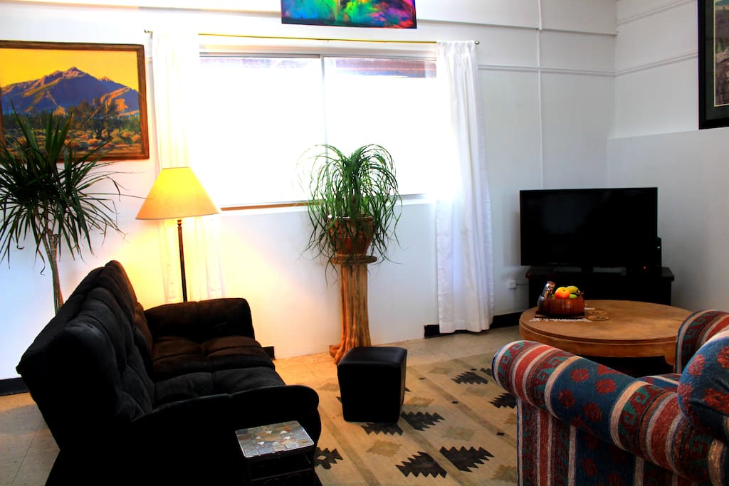 Living room of guest house including the couch-futon on the left.