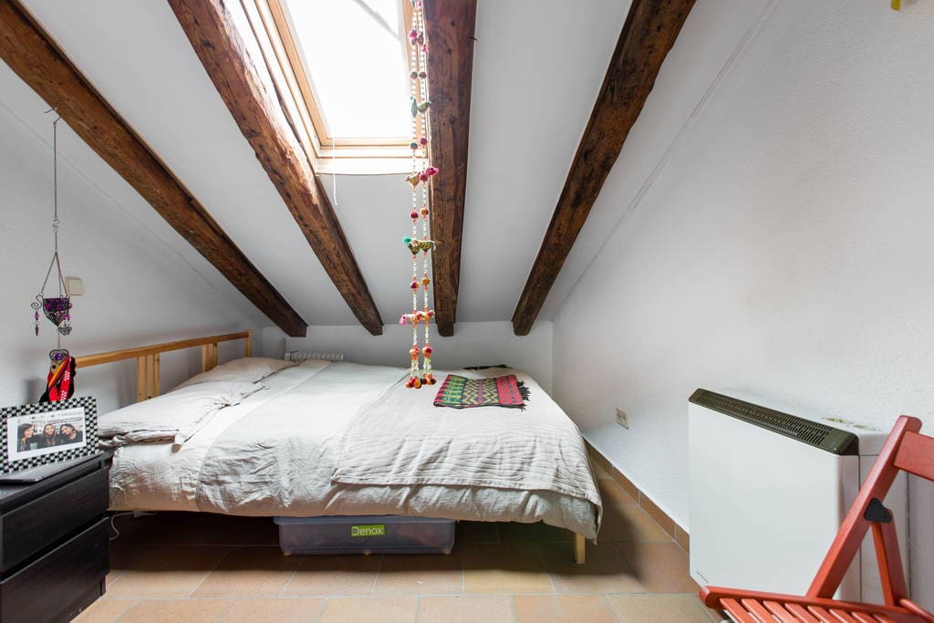 Bedroom with double bed and desk
