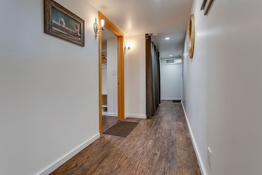 The downstairs hallway leading to the studio entrance on the left