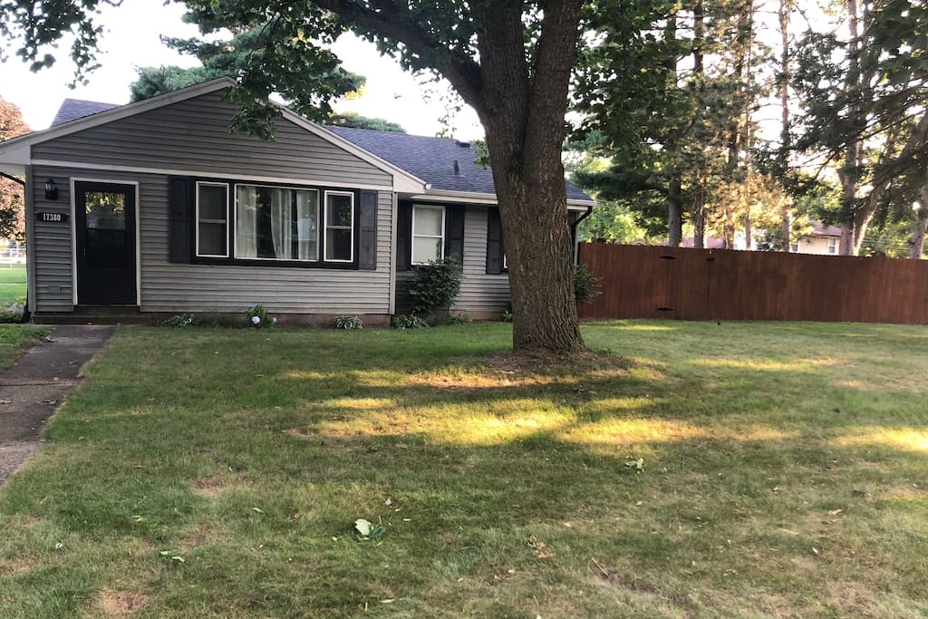 Front of home with full fenced in back yard