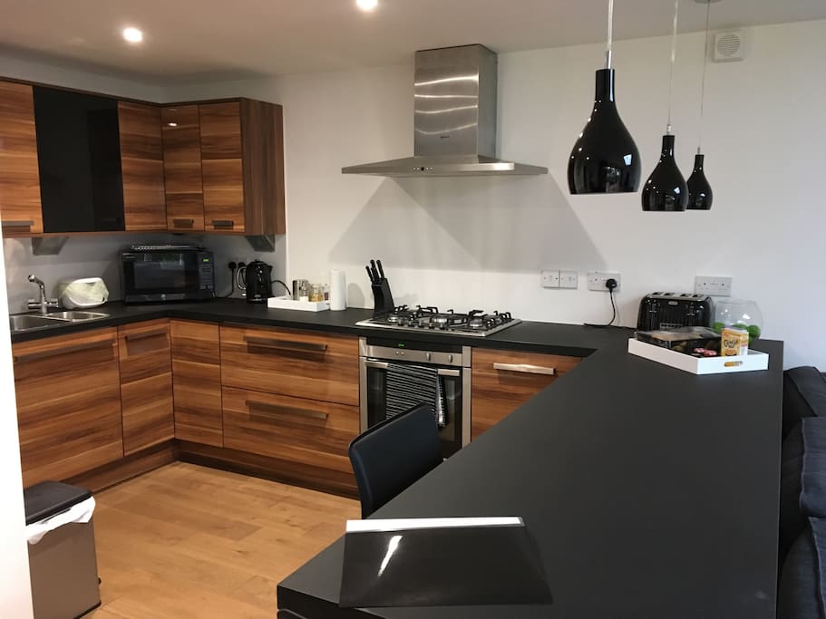 Full fitted kitchen with breakfast bar and USB points for chargers and laptops