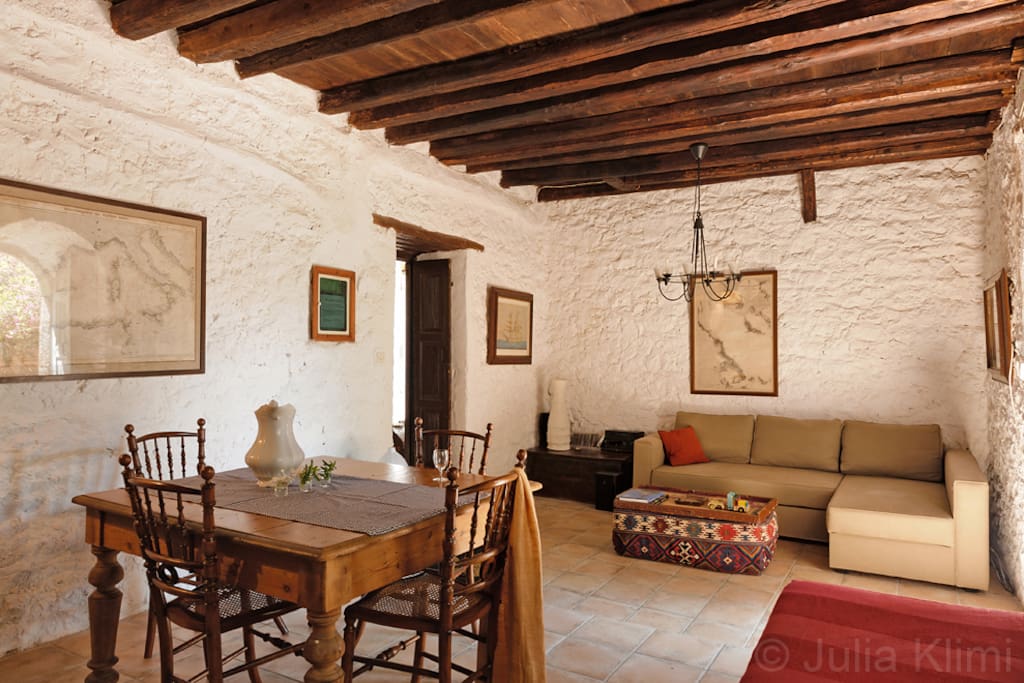 Dine in style in an elegant living cum dining room. Nautical Maps and paintings of boats on the walls