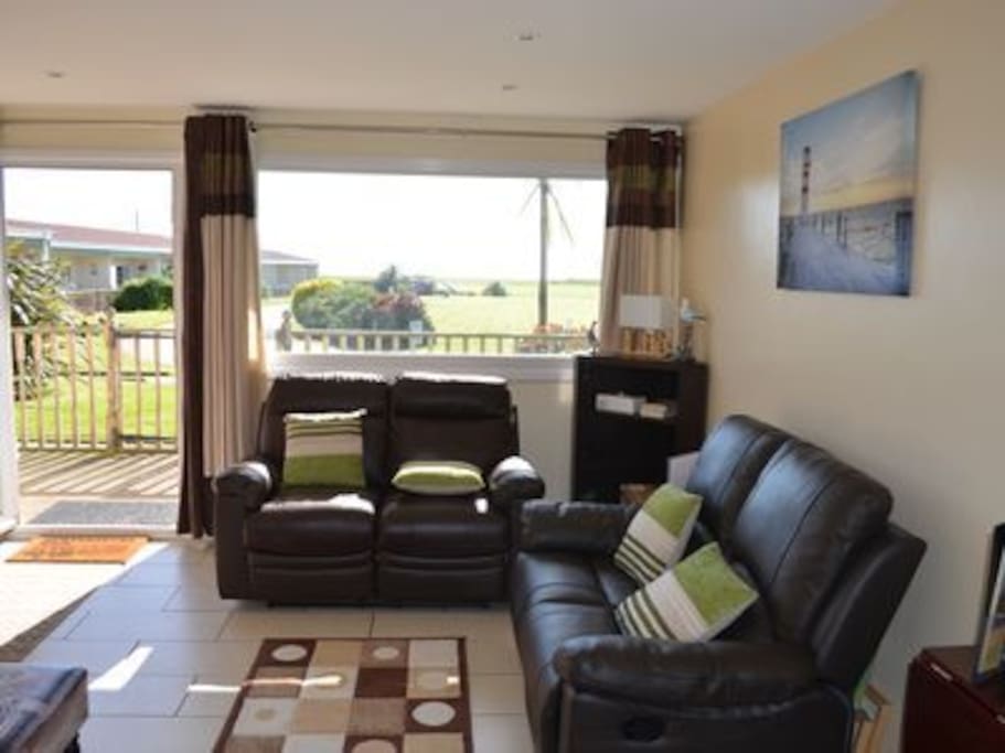 Take it easy in the open plan Lounge with sea views