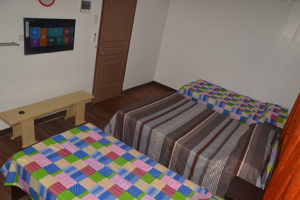 Room 4 - 2nd floor can accommodate 4 guests. 2 single beds, 1 double bed