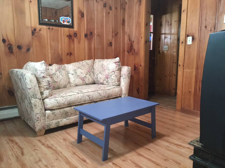Living room space with cable TV, DVD player and DVD's