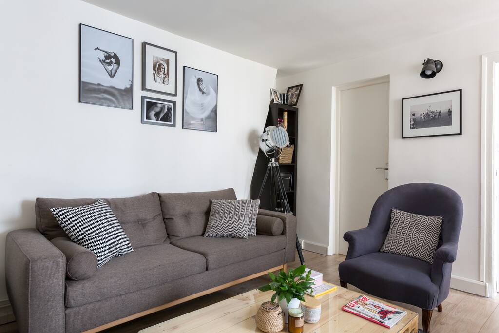 Our cute living room with a couch, 1 large dining table...