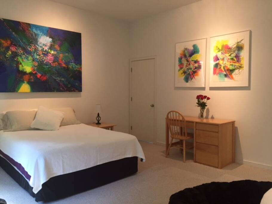 Private guest bedroom with desk