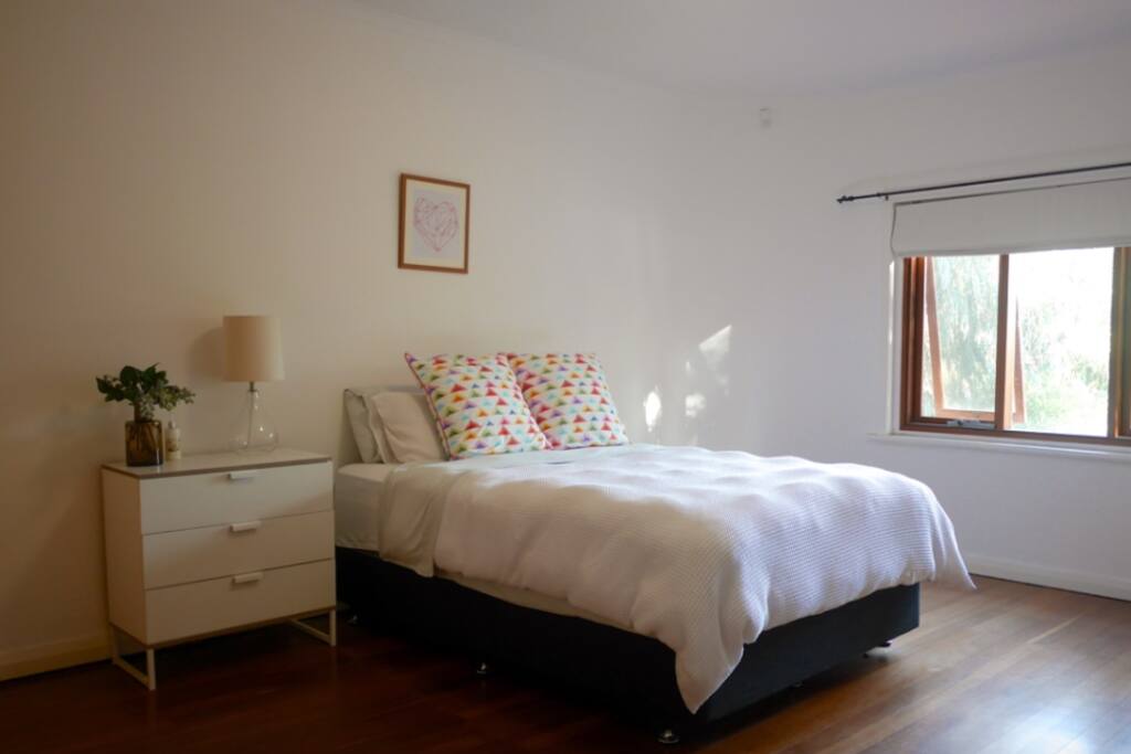 Main bedroom - wake up to native trees and birds, plenty of natural light, large built in wardrobe and lots of storage space.