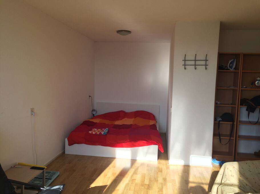 Bed and Towel prepared, on a sunny afternoon.