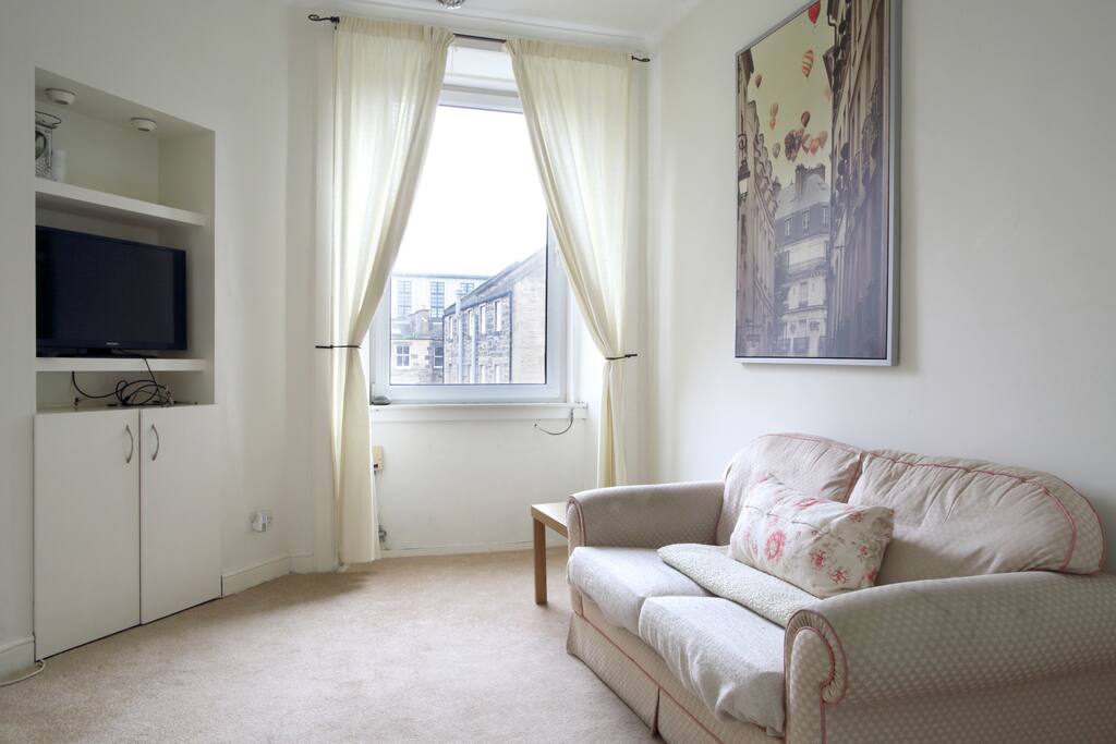 Relax and watch some TV or read a book in our living room.