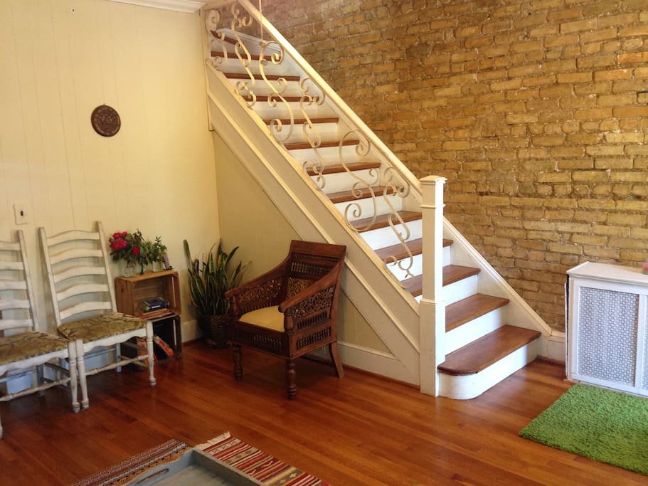 Spacious living room with exposed brick