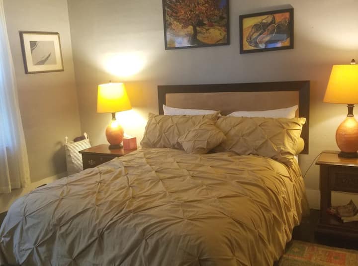 Queen size bed, Down comforter, pillows and linens provided. 
Window A/C unit,   floor fan, Central heating, Dresser and closet 
