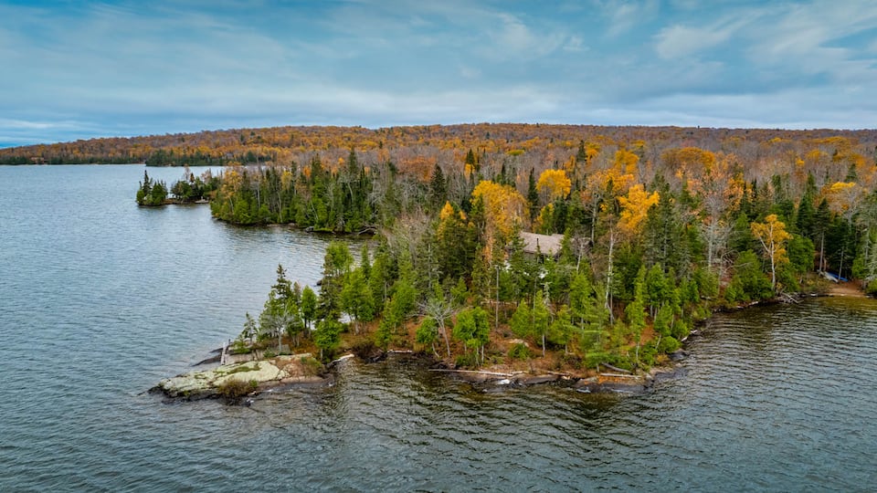 A stone-and-bark cabin on Lake Medora, Eagle Harbor Township, Michigan, United States, photo 6 of 10