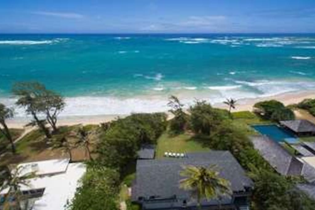 Two homes sit side by side on one of the North Shore's semi-private, sugary white sand beaches. Amazing space for large families or a coroporate retreat. We have an infinity pool, jacuzzi and incredible gardens.