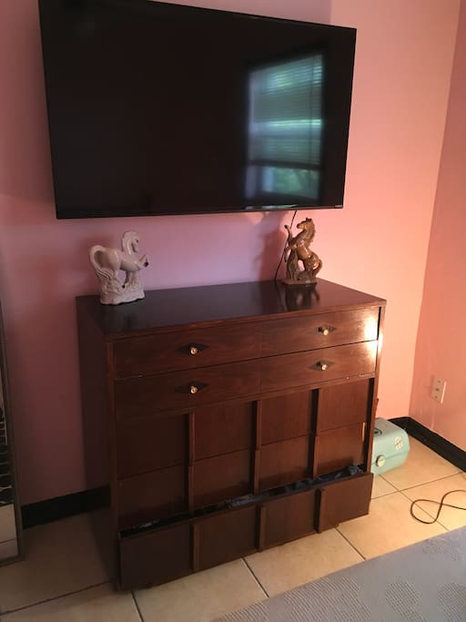 Tv equipped with Netflix and Hulu available for use.