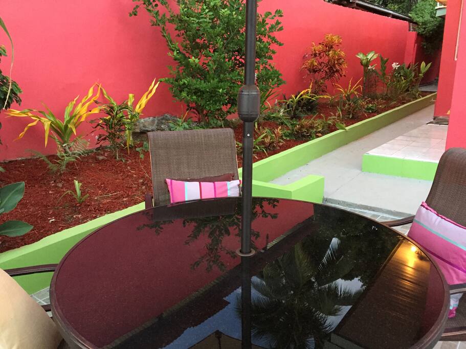 Relax by the garden complete with fruit trees and other plants.