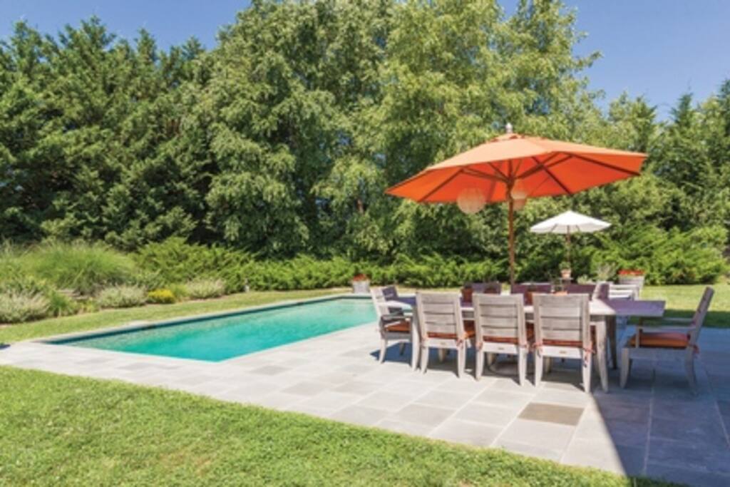 Outdoor dining area with lush garden view/bordering 8 acre preserve