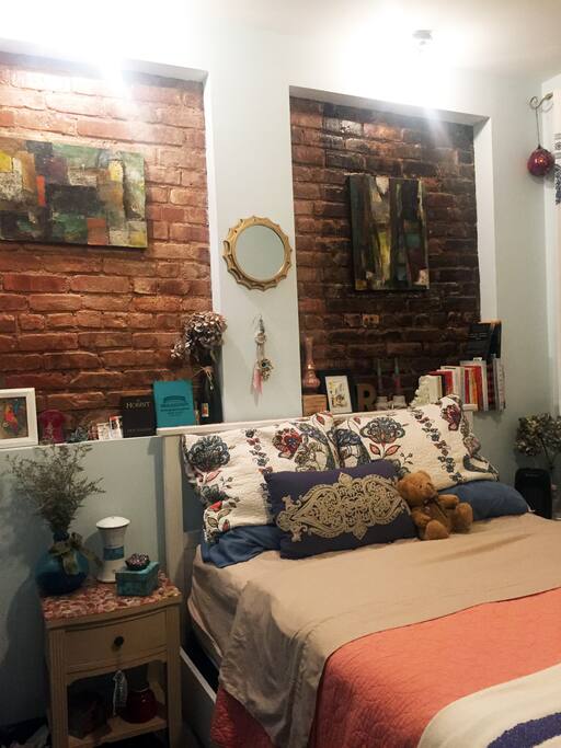 Double bed, exposed brick and two big windows facing the quiet back yard