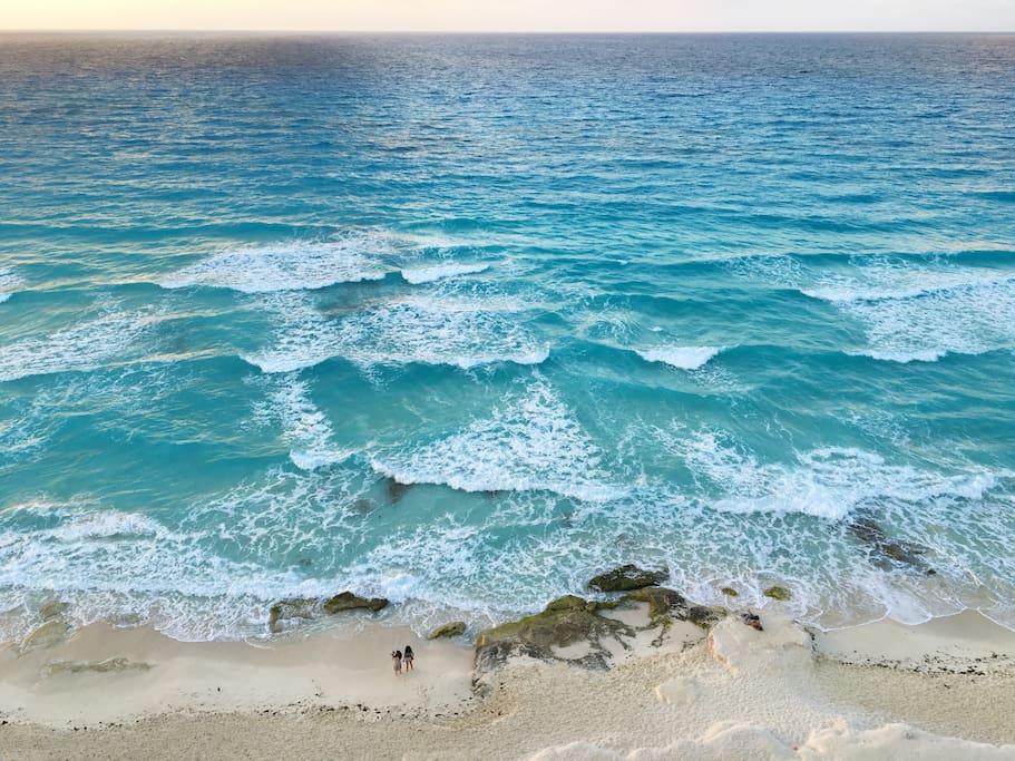 This is your view from the balcony PH1A - looking down at the beach and nice rock formation in front of our condo.