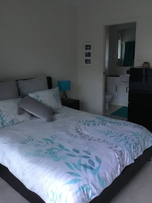 Master bedroom with ensuite and balcony access.