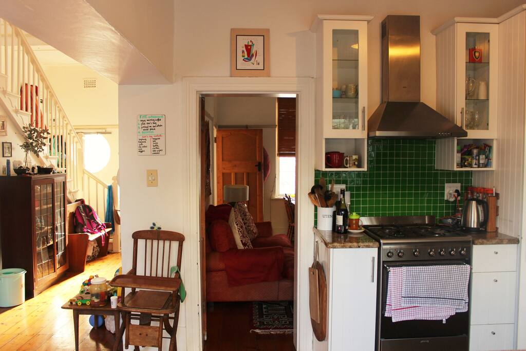 Open plan kitchen, connecting to lounge (straight ahead) and entrance hall (to the left).