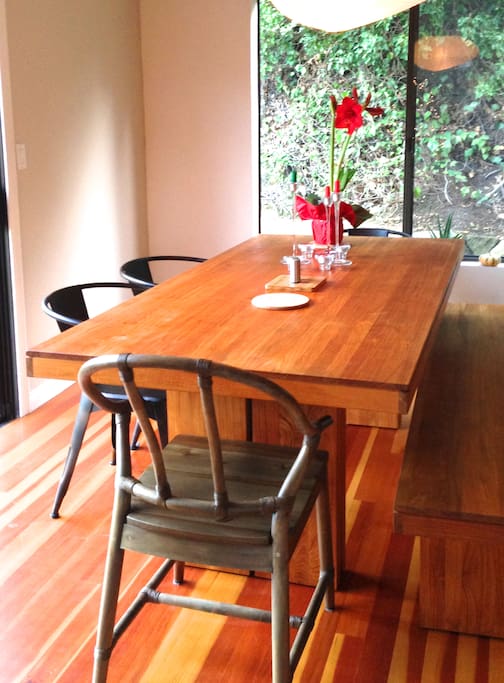 The long wooden dining table will easily fit everyone.