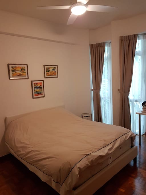 Your queensize bed with hotel featherbed on top of mattress