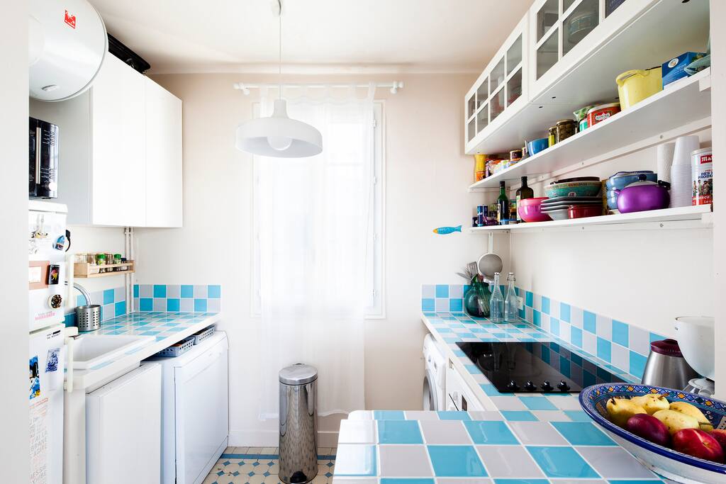 Open plan kitchen with dishwasher, washing machine, fridge, freezer, oven, microwave