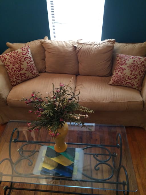 Couch in living room does NOT pull out but is very COMFY to sleep on